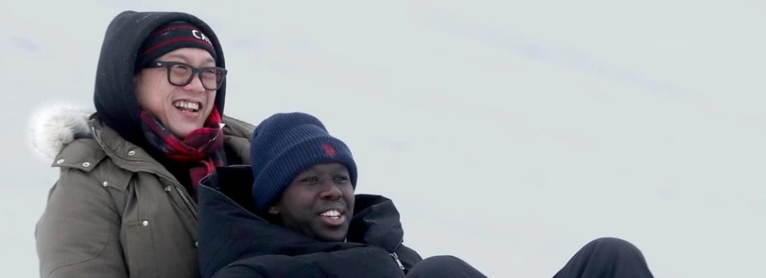 Dave Nguyen and Chance Niyomugabo enjoy a toboggan ride together. (Photo via The Valley Spreader’s Facebook page.)
