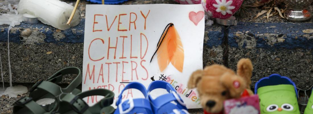 A memorial in memory of the 215 unmarked graves found at the Kamloops Indian Residential School in Kamloops, B.C., grows on the steps of city hall in Calgary, Alberta, on June 8, 2021. (THE CANADIAN PRESS/Jeff McIntosh)