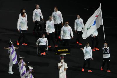 Athletes for the Refugee Paralympic team enter the stadium during the opening ceremony for the 2020 Paralympics at the National Stadium in Tokyo, on August 24, 2021. (AP Photo/Eugene Hoshiko) Athletes for the Refugee Paralympic team enter the stadium during the opening ceremony for the 2020 Paralympics at the National Stadium in Tokyo, on August 24, 2021. (AP Photo/Eugene Hoshiko)