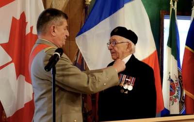 Joseph Novak receiving his award from General Benoît Puga at the Whitehorse legion on October 20.