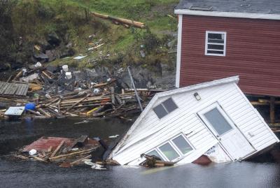 Buildings sit in the water along the shore following hurricane Fiona in Rose Blanche-Harbour Le Cou, Newfoundland on September 27, 2022. (THE CANADIAN PRESS/Frank Gunn) 