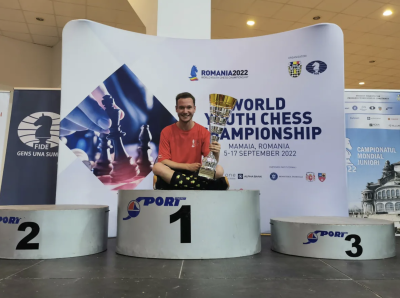 Shawn Rodrigue-Lemieux is pictured with his trophy after beating out players from 54 countries at the world under-18 chess championships in Romania.