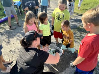 The whole community was invited to watch the Mohawk Council of Akwesasne release the baby snapping turtles. (Photo via the Mowhawk Council of Akwesasne’s Facebook page.)