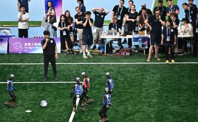 Robots compete in soccer at the World Humanoid Robot Games. (Photo via Facebook.)