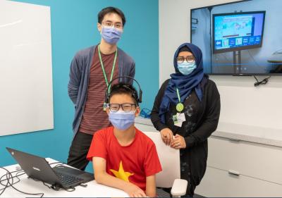 Researchers at Holland Bloorview Kids Rehabilitation hospital work with a patient using Brain Computer Interface technology. (Photo via Holland Bloorview Kids Rehabilitation Hospital’s Facebook page.)