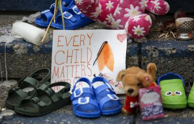 A memorial in memory of the 215 unmarked graves found at the Kamloops Indian Residential School in Kamloops, B.C., grows on the steps of city hall in Calgary, Alberta, on June 8, 2021. (THE CANADIAN PRESS/Jeff McIntosh)