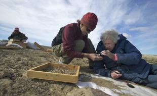 Dr. Natalia Rybczynski (left) and Dr. Mary Dawson search for fossils at Haughton Crater. (Photo used with permission from the Canadian Museum of Nature.)